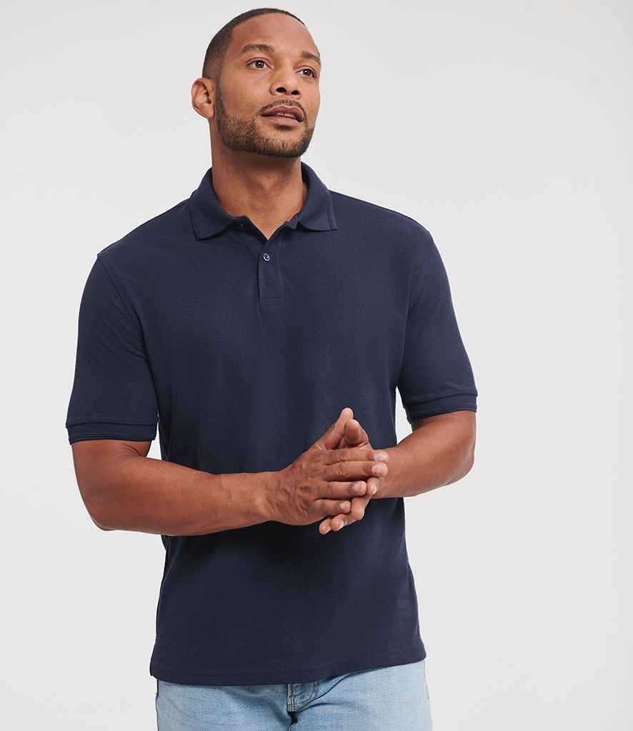 Russell Athletic 599M hardwearing piqué polo shirt in French Navy, worn by a model