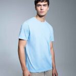 Anthem Unisex Organic Midweight T-Shirt in Light Blue, worn by a model