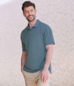 Henbury H475 Coolplus wicking piqué polo shirt in Airforce Blue, worn by a model