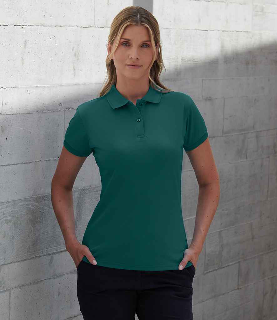Henbury H476 ladies Coolplus wicking piqué polo shirt in Bright Jade, worn by a model