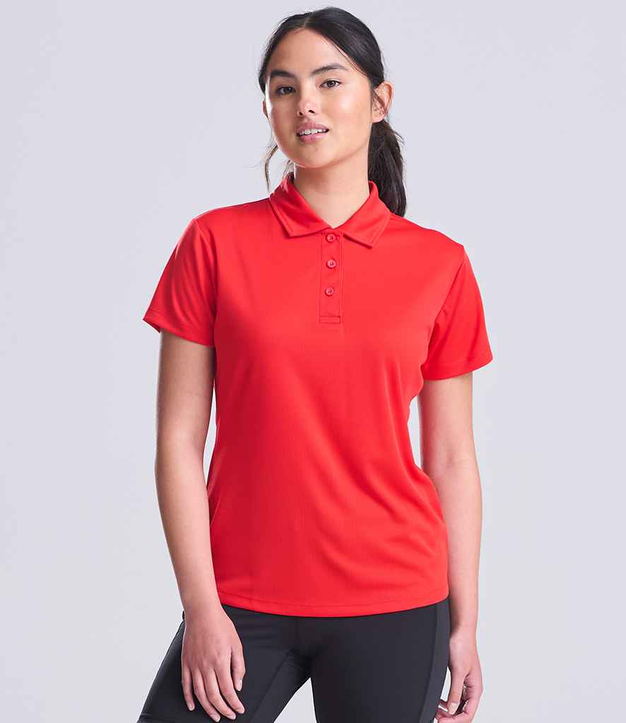 AWDis JC045 ladies Cool polo shirt in Fire Red, worn by a model