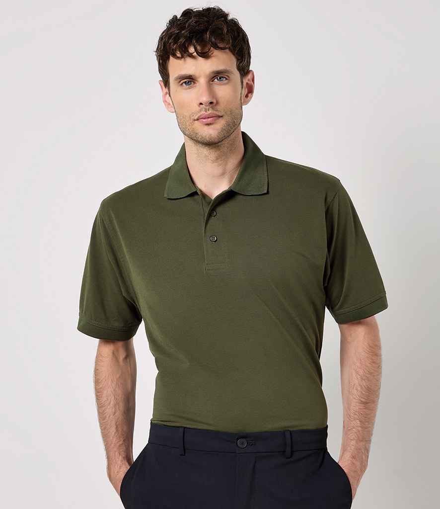 Kustom Kit K403 Klassic piqué polo shirt in Army Green, worn by a model